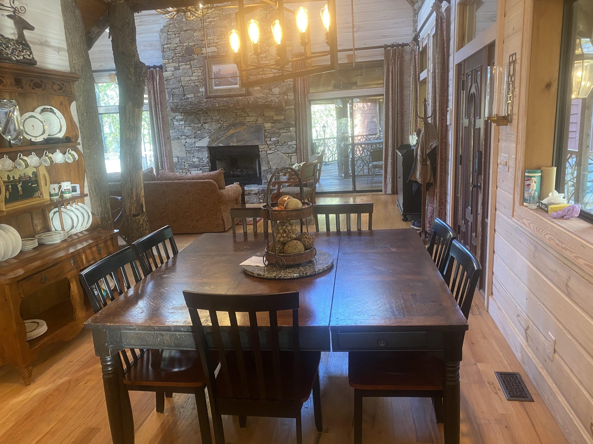 Dining table with mountain forest views through the windows