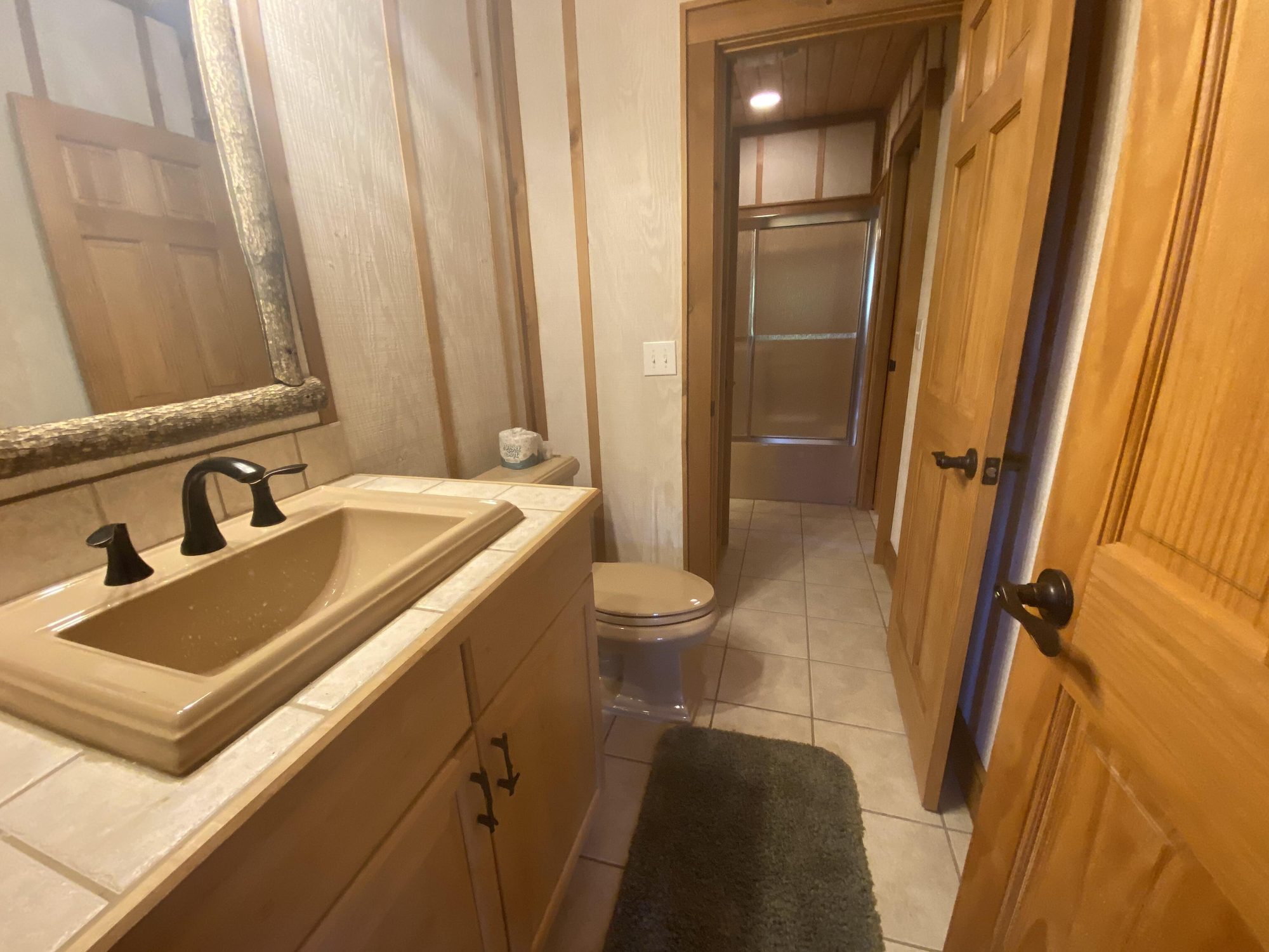 Full bathroom on the lower level beside the bunk room