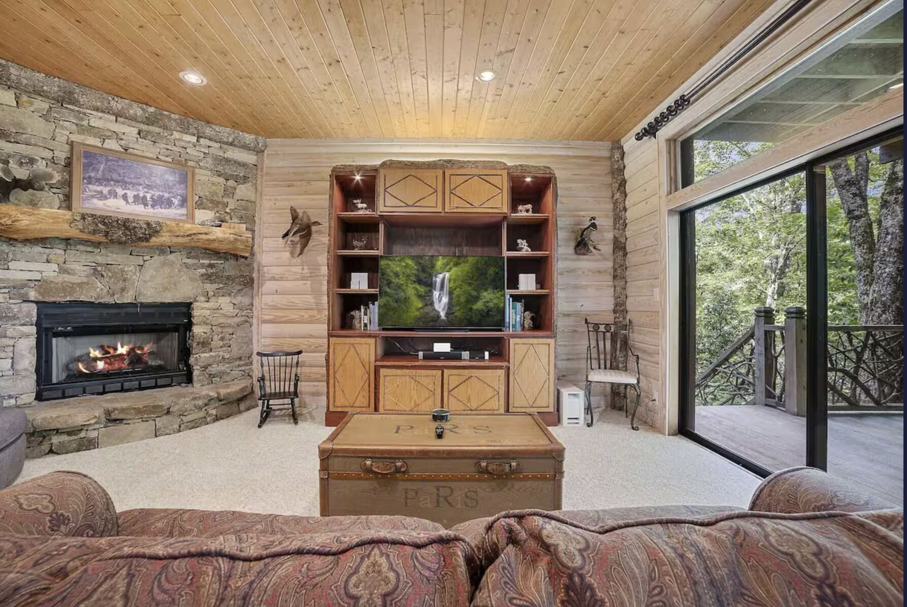 Television and seating in the lower-level den