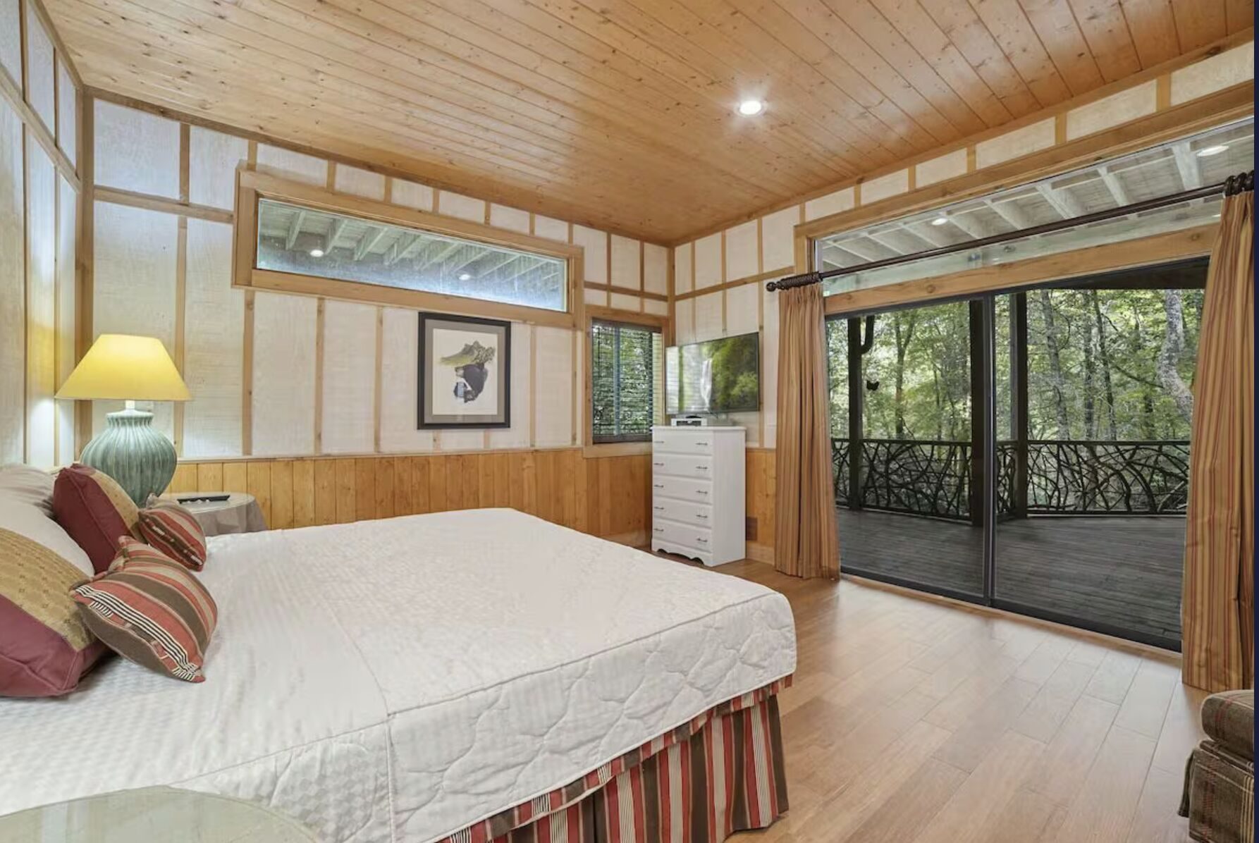 Lower-level king bedroom with the hot tub just outside