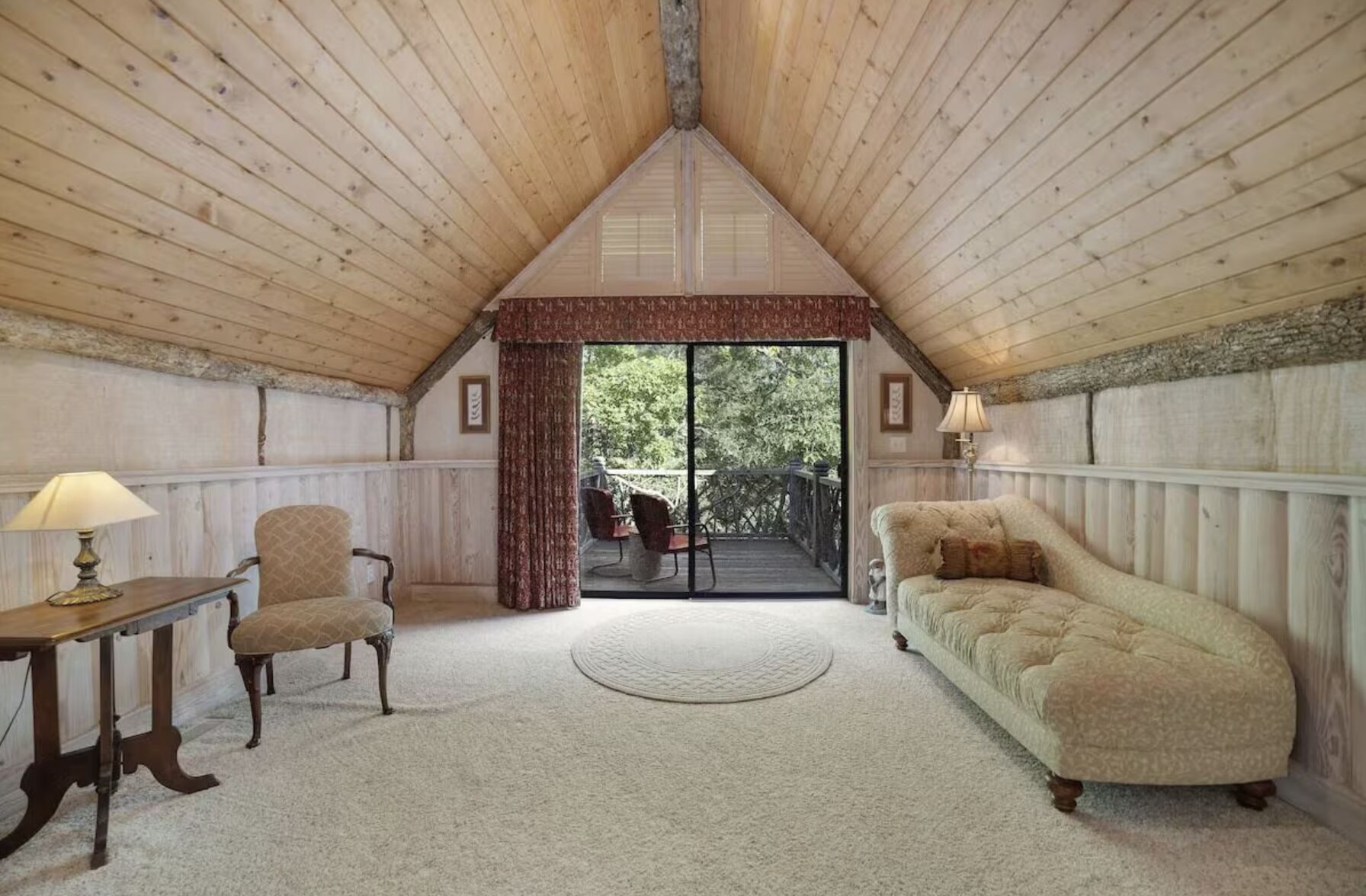 Private sitting room off the upper primary suite with its own balcony