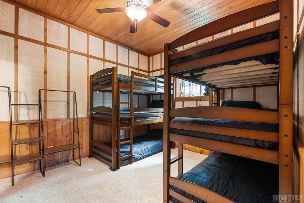 Bunk room with two sets of triple bunks, sleeping six children