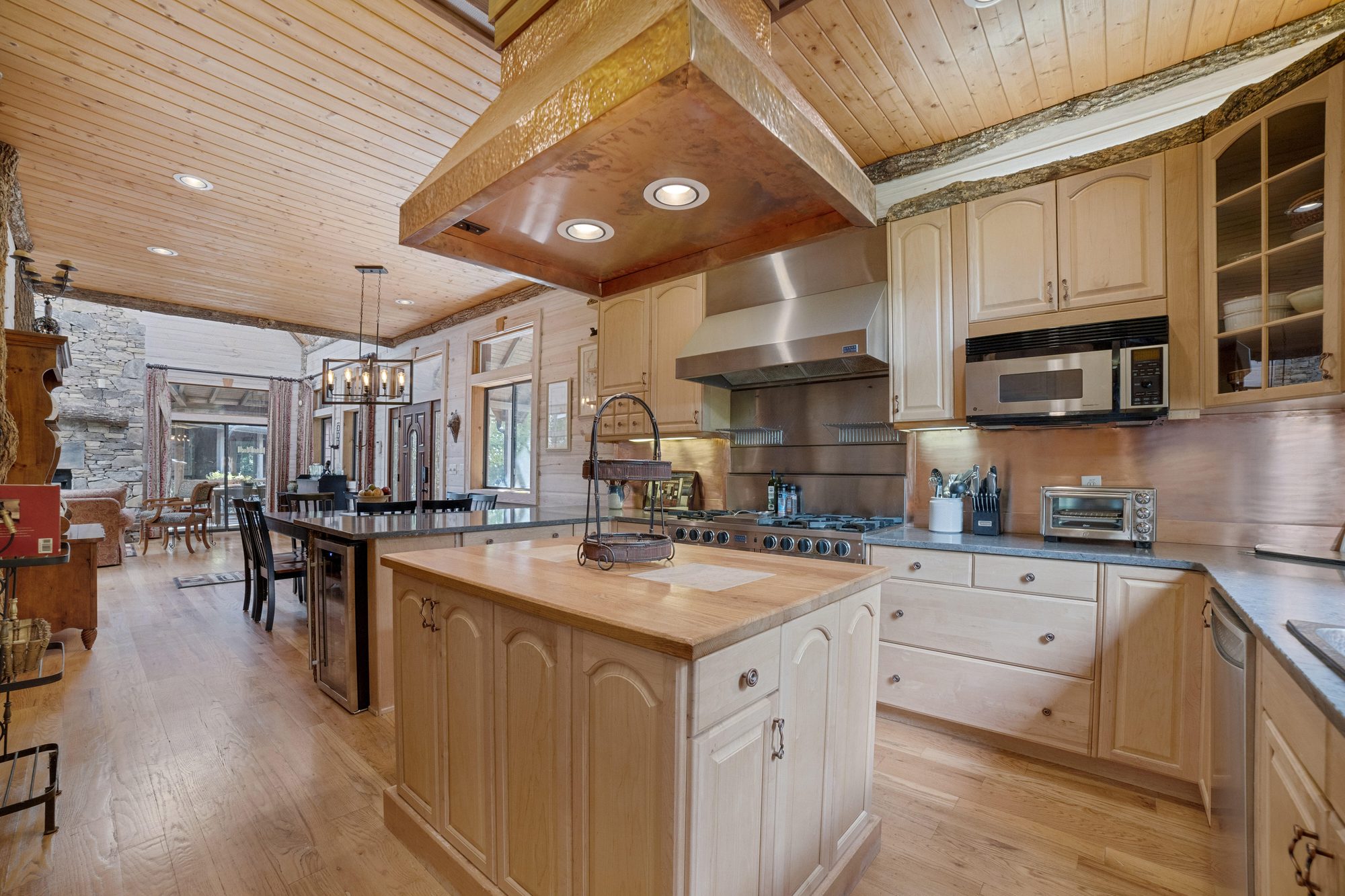 Chef's kitchen with central island, gas range and double ovens