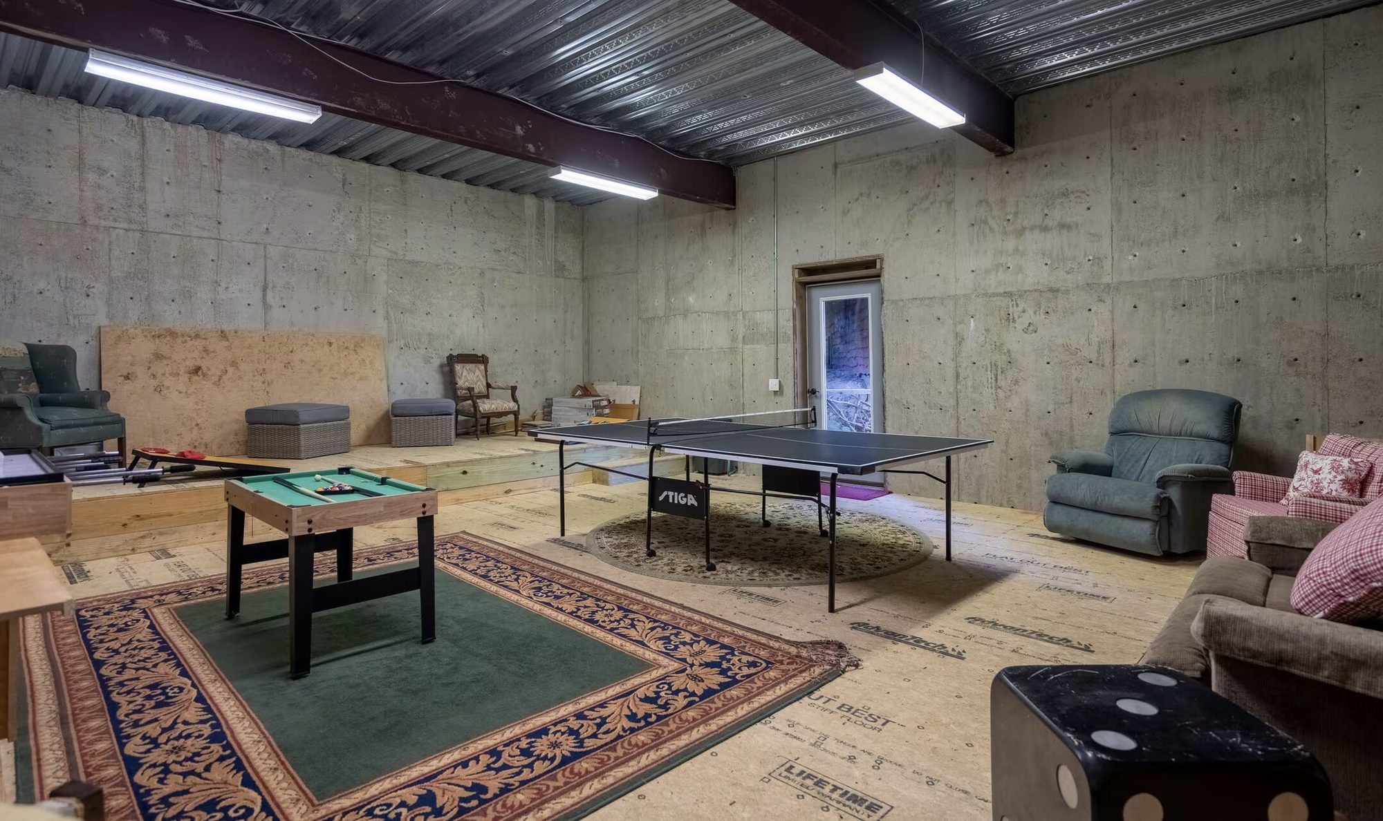 Screen-free game room with billiards, foosball and games
